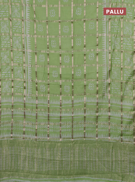 Semi chanderi saree pista green and off white with allover zari checks & batik prints and batik printed border