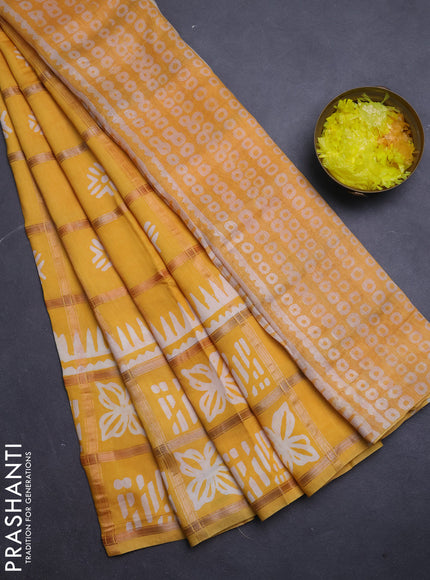 Semi chanderi saree yellow and off white with allover zari checks & batik prints and batik printed border