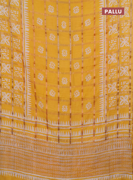 Semi chanderi saree yellow and off white with allover zari checks & batik prints and batik printed border