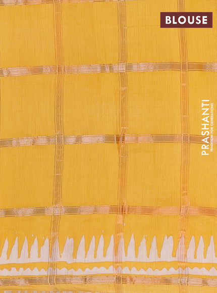 Semi chanderi saree yellow and off white with allover zari checks & batik prints and batik printed border