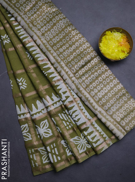 Semi chanderi saree mehendi green and off white with allover zari checks & batik prints and batik printed border