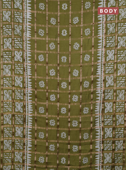 Semi chanderi saree mehendi green and off white with allover zari checks & batik prints and batik printed border
