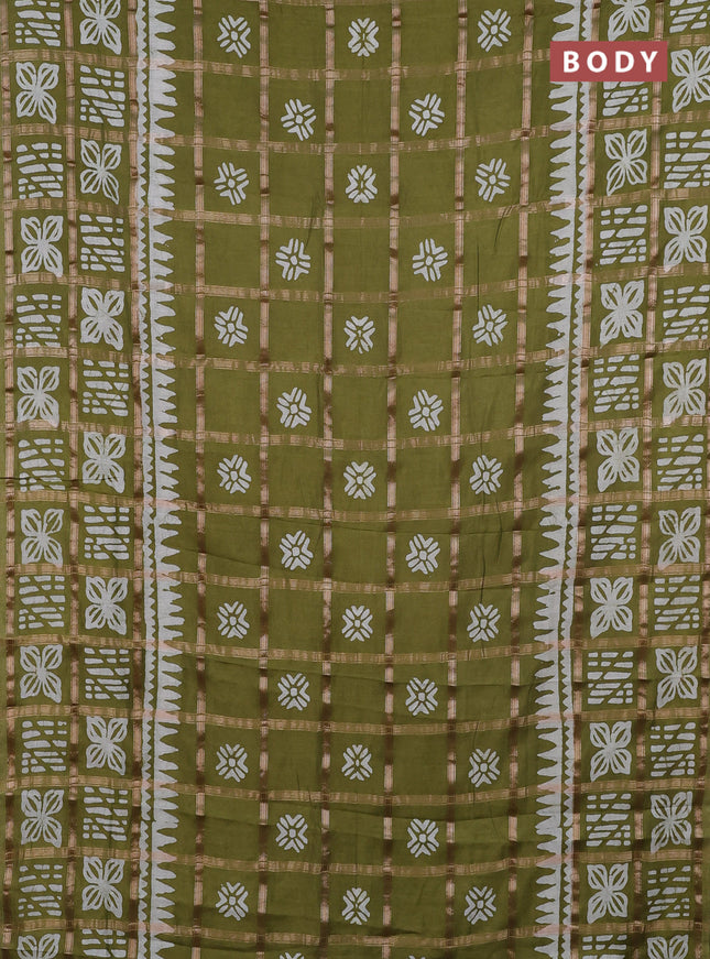 Semi chanderi saree mehendi green and off white with allover zari checks & batik prints and batik printed border