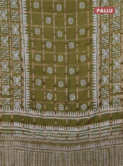 Semi chanderi saree mehendi green and off white with allover zari checks & batik prints and batik printed border