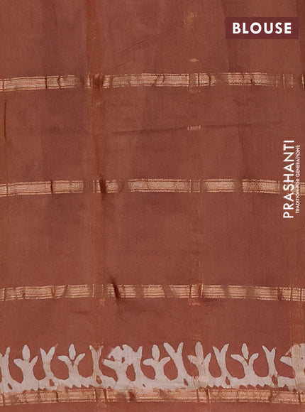 Semi chanderi saree pastel brown with allover zari checks & batik prints in borderless style