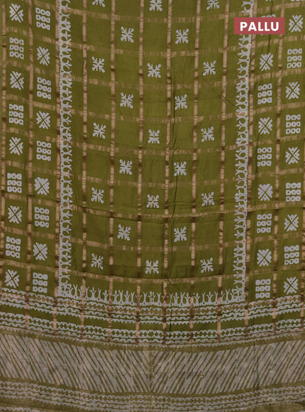 Semi chanderi saree olive green with allover zari checks & batik prints in borderless style