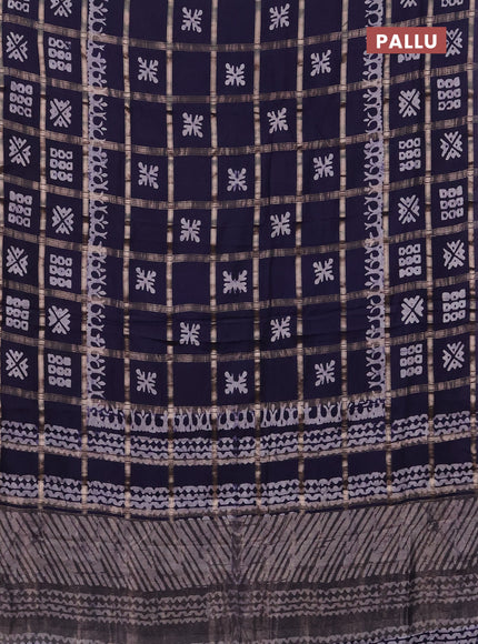 Semi chanderi saree navy blue with allover zari checks & batik prints in borderless style