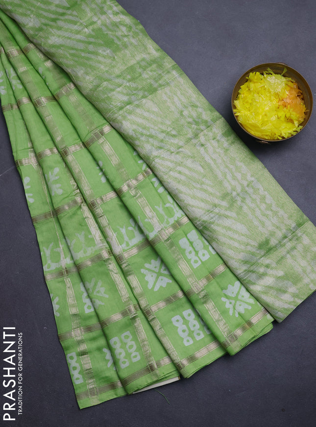Semi chanderi saree parrot green with allover zari checks & batik prints in borderless style