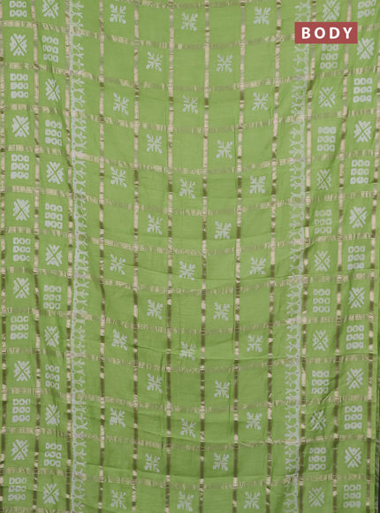 Semi chanderi saree parrot green with allover zari checks & batik prints in borderless style