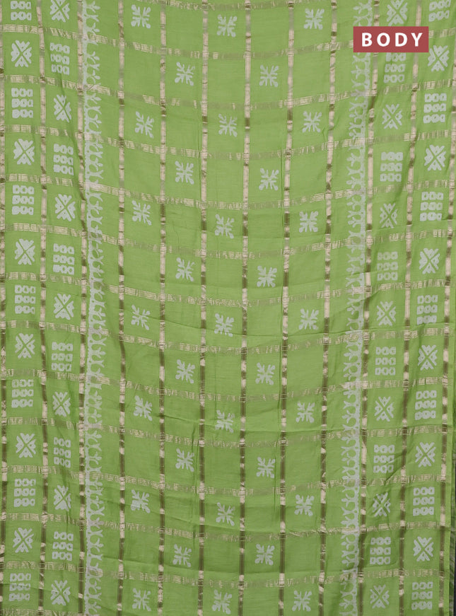 Semi chanderi saree parrot green with allover zari checks & batik prints in borderless style