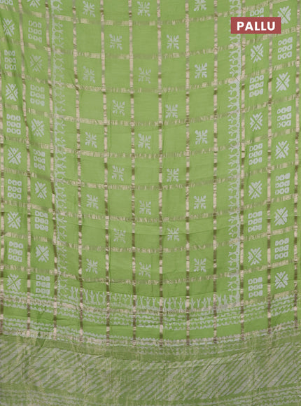Semi chanderi saree parrot green with allover zari checks & batik prints in borderless style