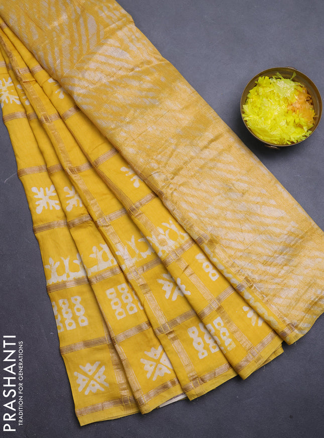 Semi chanderi saree yellow with allover zari checks & batik prints in borderless style