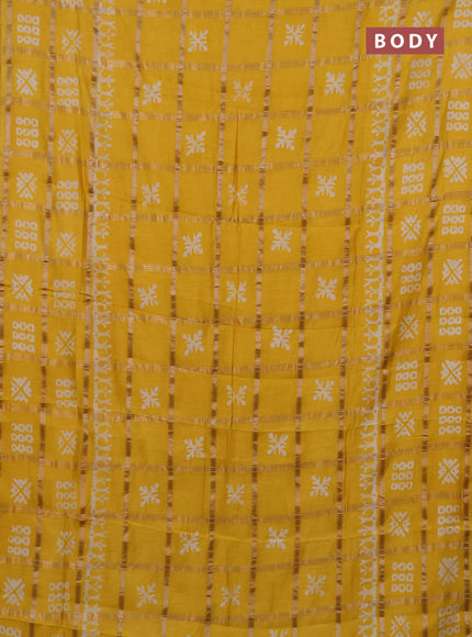 Semi chanderi saree yellow with allover zari checks & batik prints in borderless style