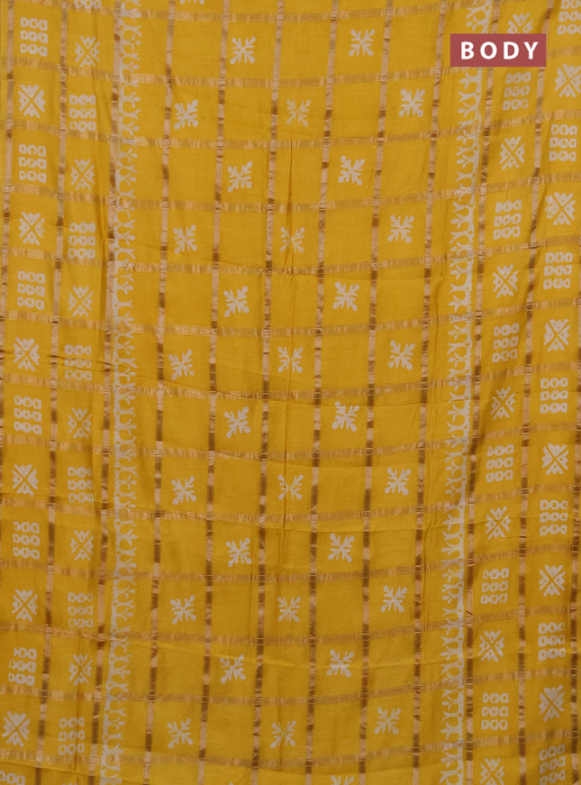 Semi chanderi saree yellow with allover zari checks & batik prints in borderless style