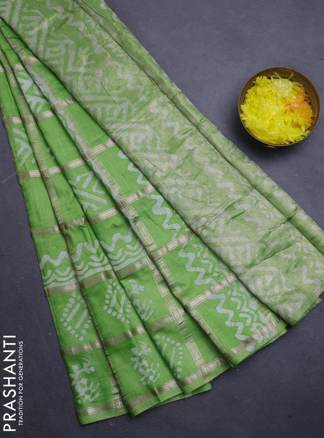 Semi chanderi saree parrot green with allover zari checks & batik prints in borderless style