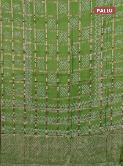 Semi chanderi saree parrot green with allover zari checks & batik prints in borderless style