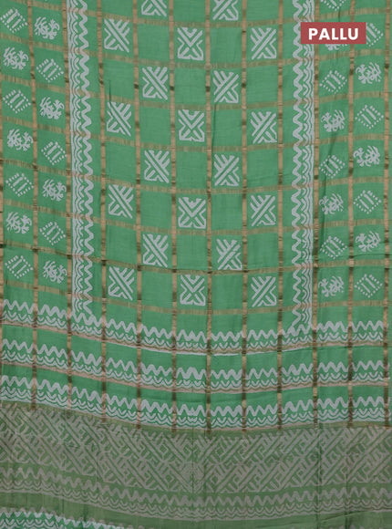 Semi chanderi saree teal green with allover zari checks & batik prints in borderless style