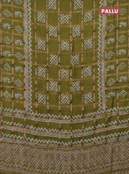 Semi chanderi saree olive green with allover zari checks & batik prints in borderless style