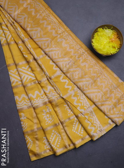 Semi chanderi saree yellow with allover zari checks & batik prints in borderless style