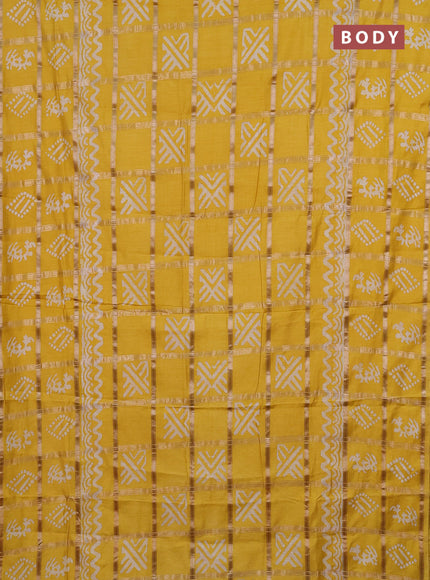 Semi chanderi saree yellow with allover zari checks & batik prints in borderless style