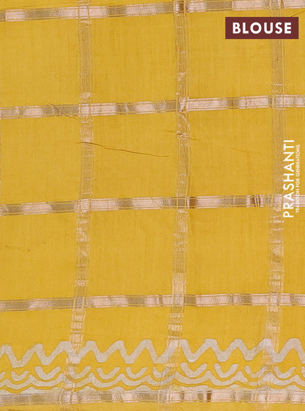 Semi chanderi saree yellow with allover zari checks & batik prints in borderless style