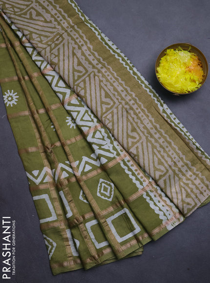 Semi chanderi saree mehendi green with allover zari checks & batik prints in borderless style