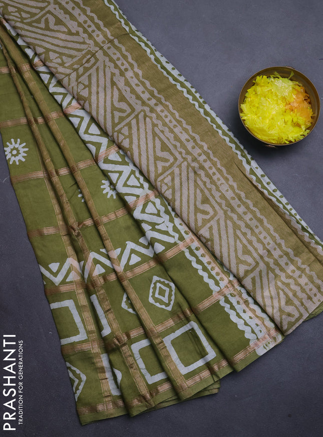 Semi chanderi saree mehendi green with allover zari checks & batik prints in borderless style
