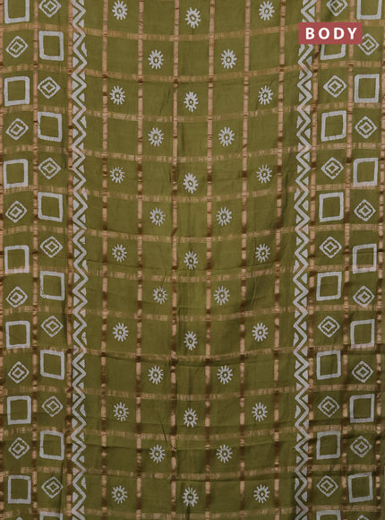 Semi chanderi saree mehendi green with allover zari checks & batik prints in borderless style
