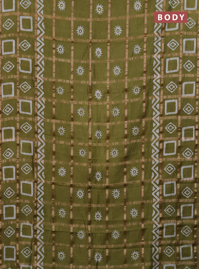 Semi chanderi saree mehendi green with allover zari checks & batik prints in borderless style