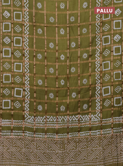 Semi chanderi saree mehendi green with allover zari checks & batik prints in borderless style