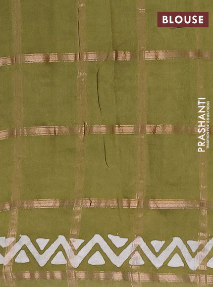 Semi chanderi saree mehendi green with allover zari checks & batik prints in borderless style