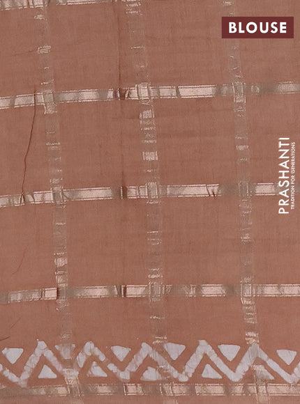 Semi chanderi saree pastel brown with allover zari checks & batik prints in borderless style