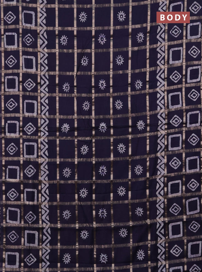 Semi chanderi saree navy blue with allover zari checks & batik prints in borderless style
