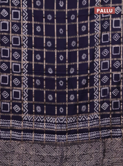 Semi chanderi saree navy blue with allover zari checks & batik prints in borderless style