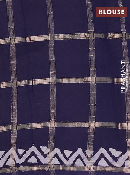 Semi chanderi saree navy blue with allover zari checks & batik prints in borderless style