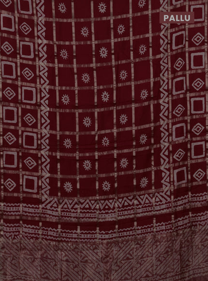 Semi chanderi saree maroon with allover zari checks & batik prints in borderless style