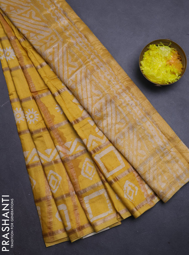 Semi chanderi saree mustard yellow with allover zari checks & batik prints in borderless style