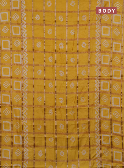 Semi chanderi saree mustard yellow with allover zari checks & batik prints in borderless style