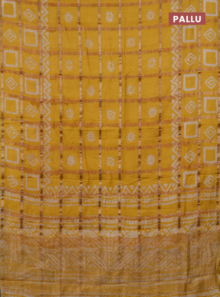 Semi chanderi saree mustard yellow with allover zari checks & batik prints in borderless style