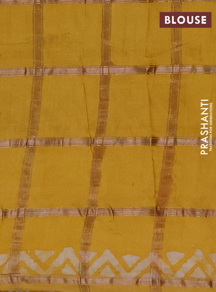 Semi chanderi saree mustard yellow with allover zari checks & batik prints in borderless style