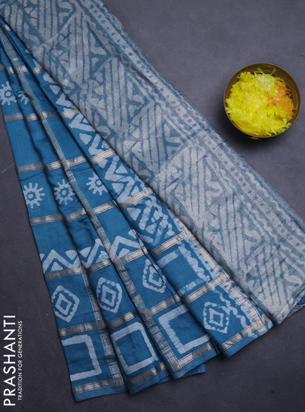 Semi chanderi saree teal blue with allover zari checks & batik prints in borderless style
