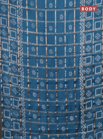 Semi chanderi saree teal blue with allover zari checks & batik prints in borderless style