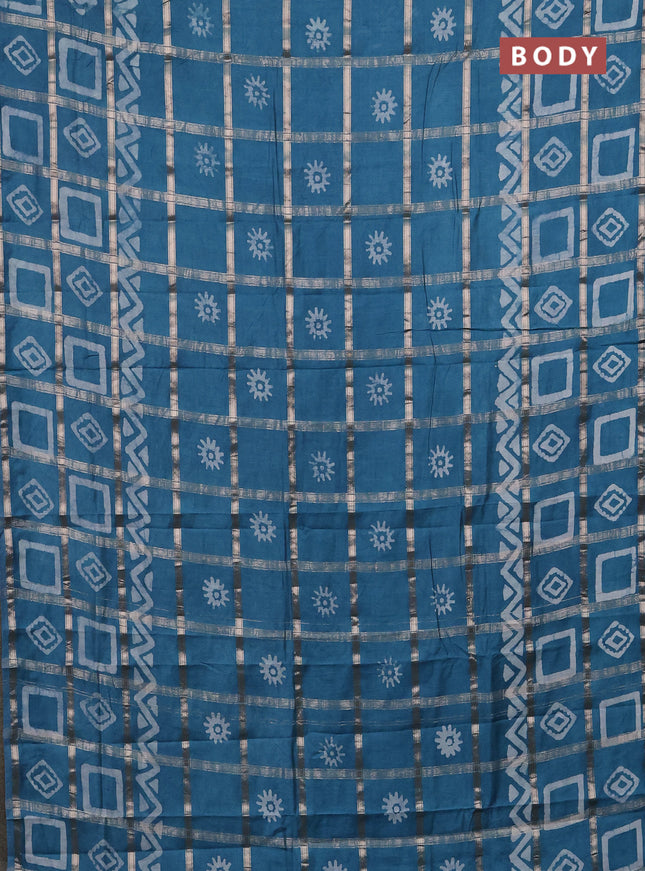 Semi chanderi saree teal blue with allover zari checks & batik prints in borderless style