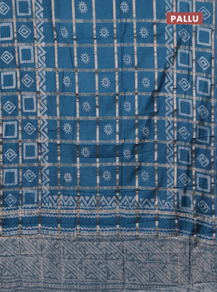 Semi chanderi saree teal blue with allover zari checks & batik prints in borderless style