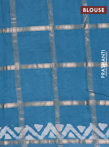 Semi chanderi saree teal blue with allover zari checks & batik prints in borderless style
