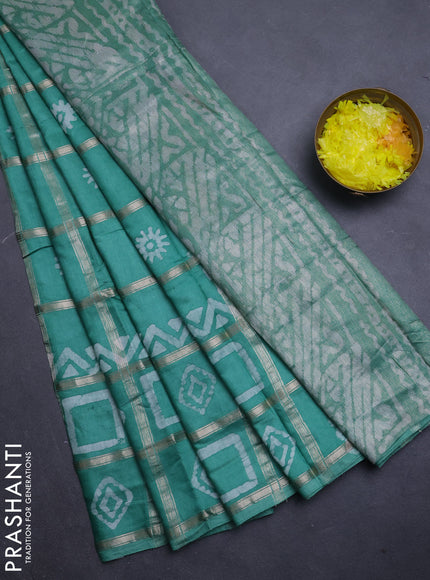 Semi chanderi saree green shade with allover zari checks & batik prints in borderless style