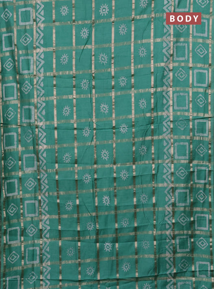 Semi chanderi saree green shade with allover zari checks & batik prints in borderless style