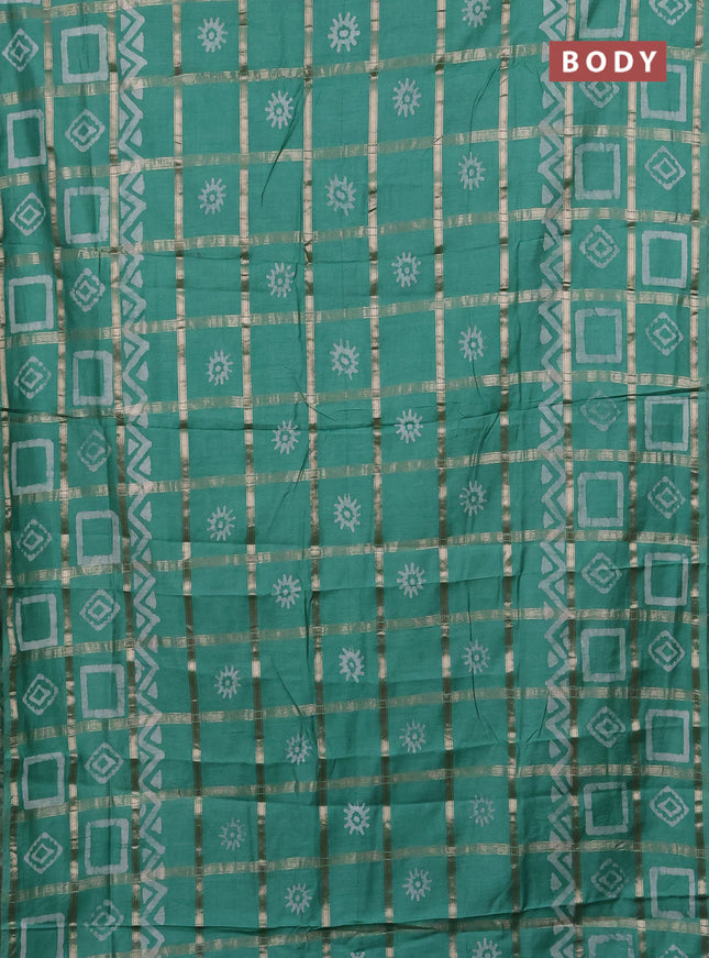 Semi chanderi saree green shade with allover zari checks & batik prints in borderless style