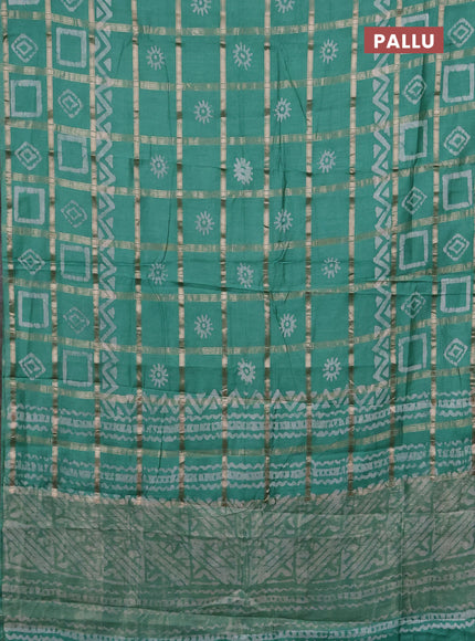 Semi chanderi saree green shade with allover zari checks & batik prints in borderless style