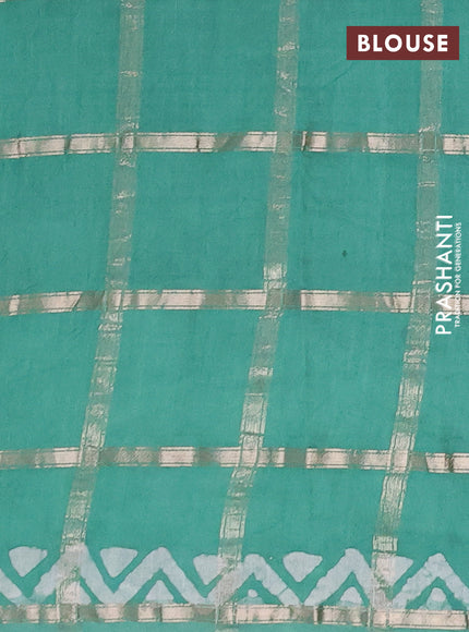 Semi chanderi saree green shade with allover zari checks & batik prints in borderless style